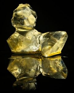 Cannabis concentrate diamonds isolated on black background